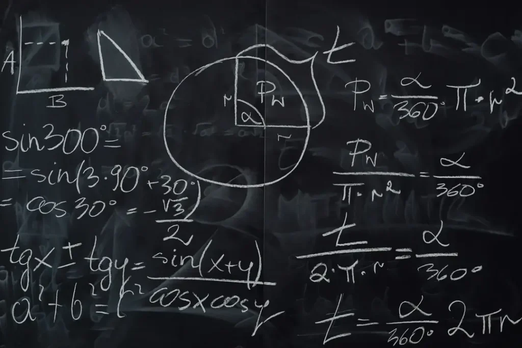 A chalkboard with mathematical equations written on it