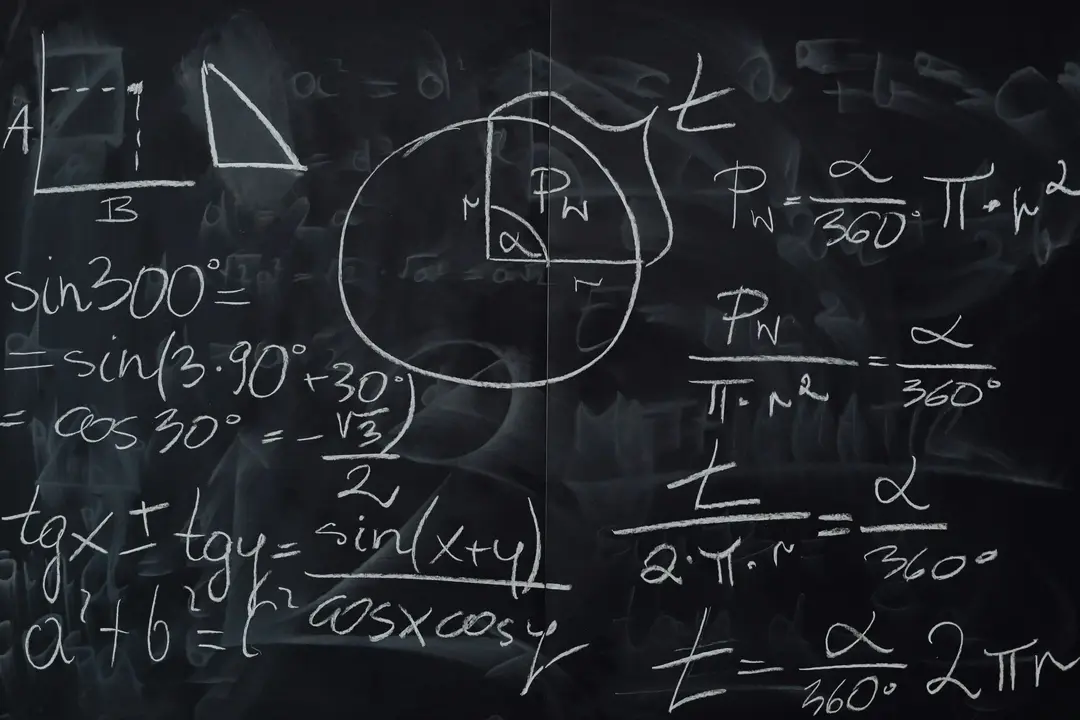 A chalkboard with mathematical equations written on it